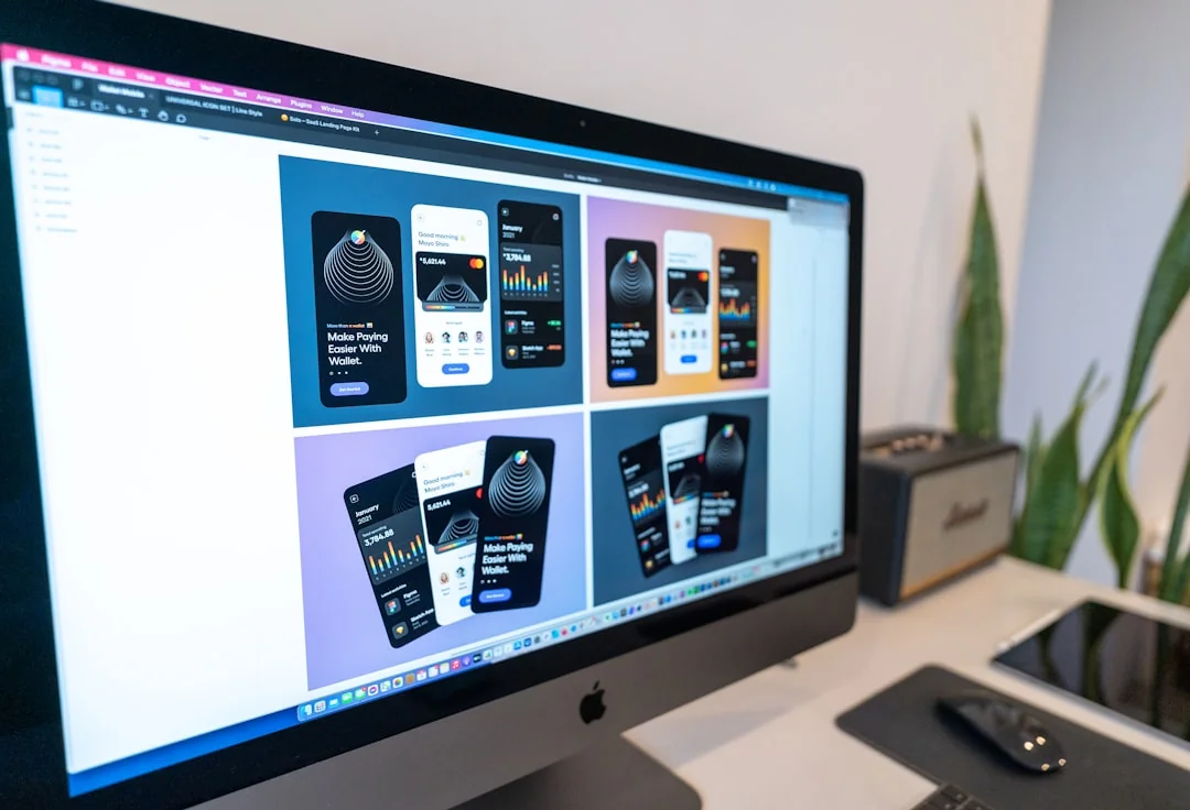 A modern workspace with a smartphone displaying a screen and a computer setup, ideal for business and technology themes.